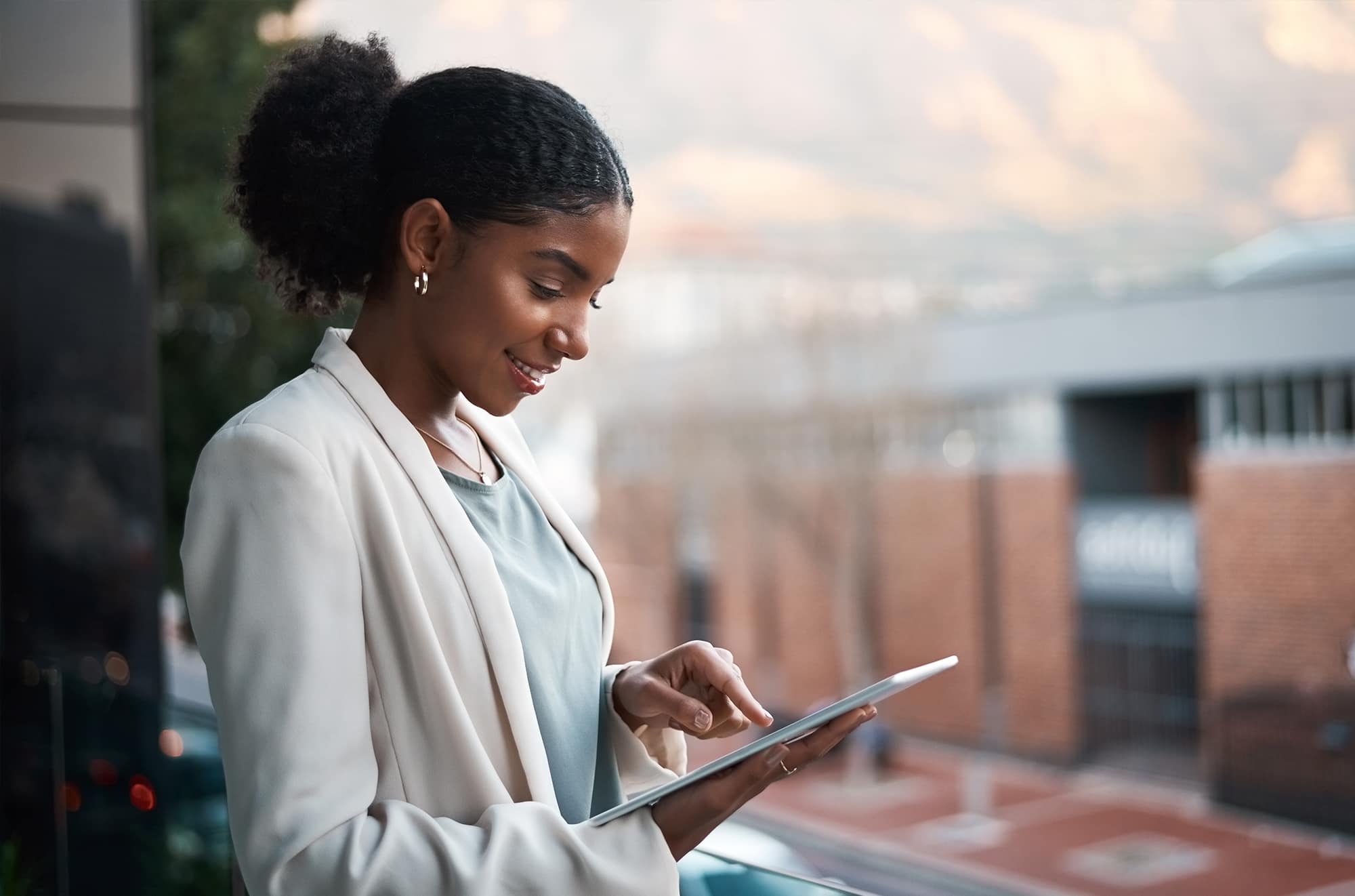 Woman looking at a tablet.