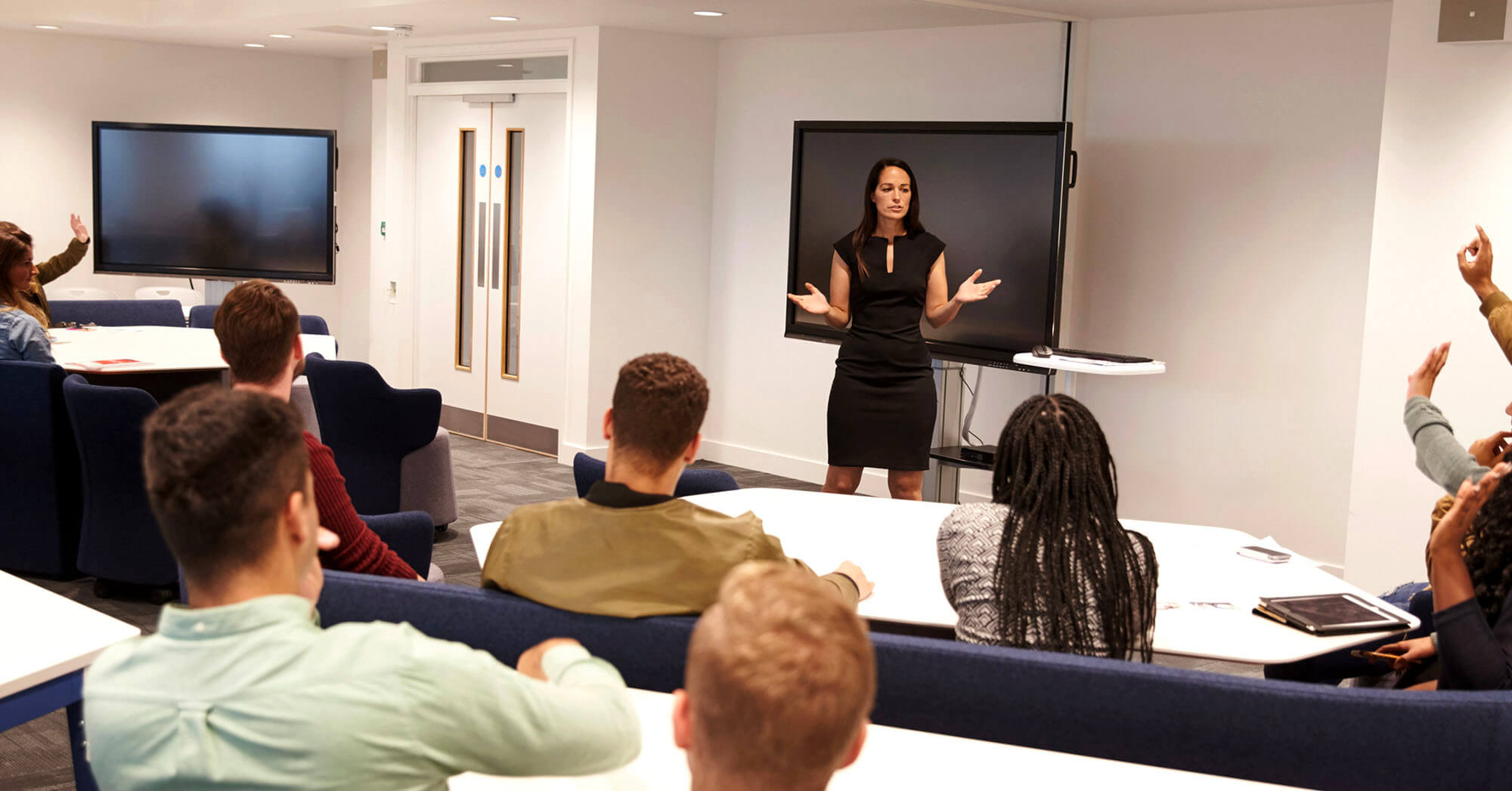 An instructor teaching a classroom of future appraisers