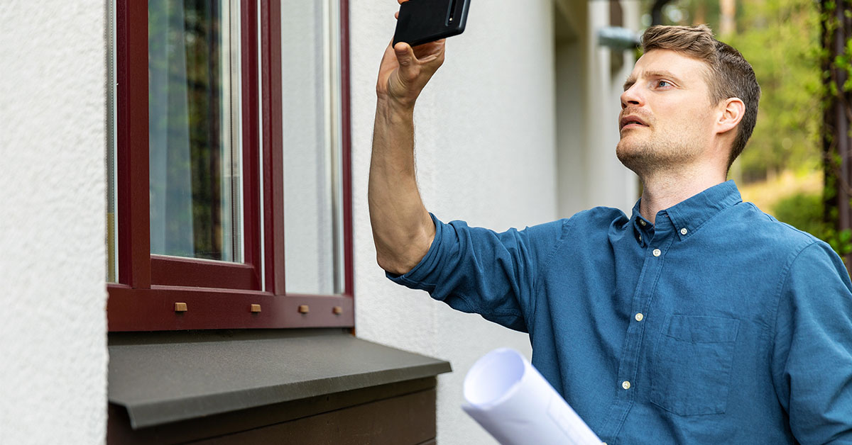 real property appraiser evaluating the exterior of a property