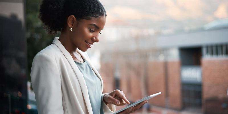 Woman looking at a tablet.