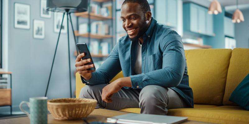 man looking at social media on phone on smart phone
