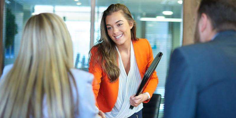 A new appraiser shaking the hands of her interviewers.