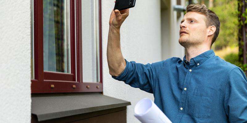 real property appraiser evaluating the exterior of a property